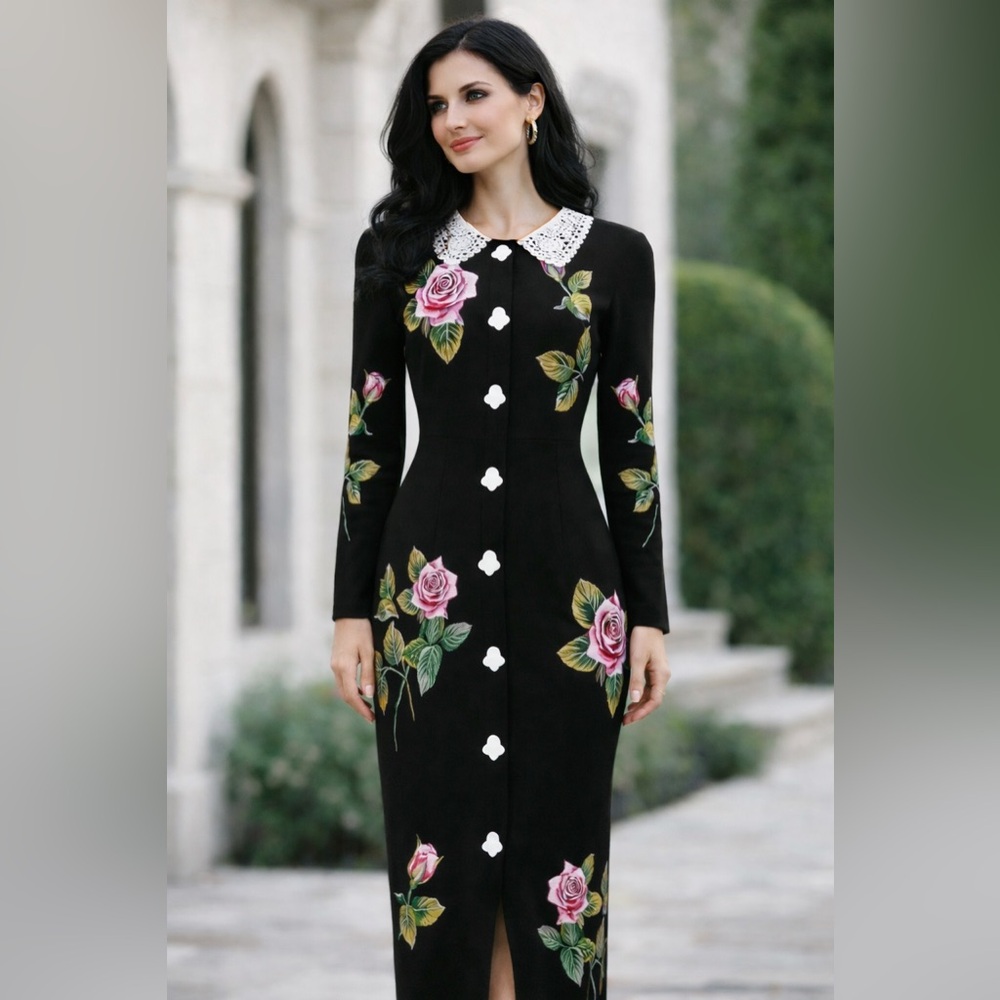 Vintage inspired black dress with embroidered flowers.